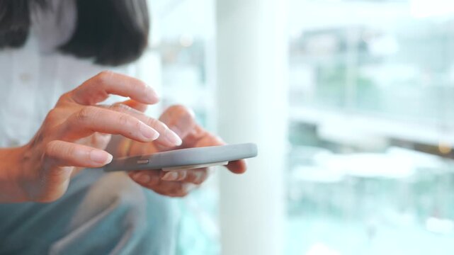 Woman using smartphone at city cafe, typing messages, searching online and making phone call, close up of mobile communication, digital lifestyle and casual business contact with blurred urban backgro