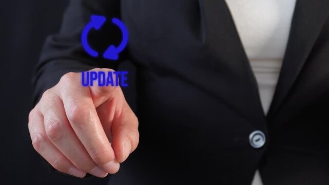Businesswoman presses virtual update button