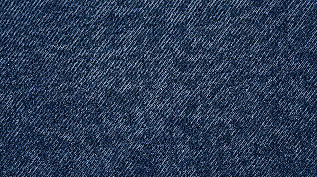 Close up view of dark blue denim fabric texture showing the woven cotton twill pattern details