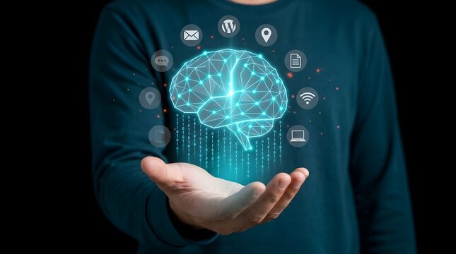 Left hand holding a glowing digital brain wireframe with floating technology