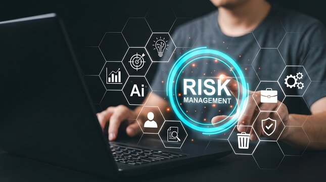 Person using laptop with digital risk management interface overlay