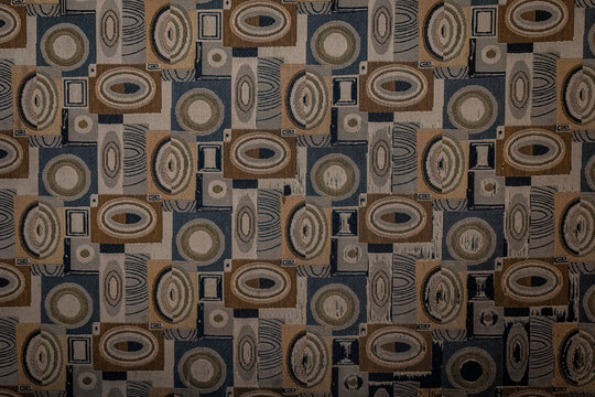 Seamless mid-century modern geometric upholstery fabric texture featuring oval and circular shapes in neutral earth tones