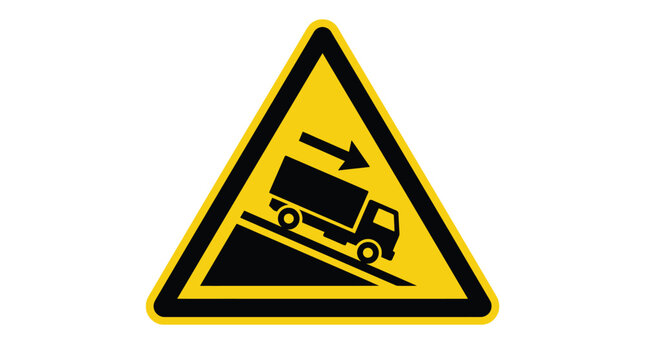 Bright yellow triangular traffic sign featuring a black descending truck graphic symbol warning drivers about steep downhill grades ahead on rural mountain roads