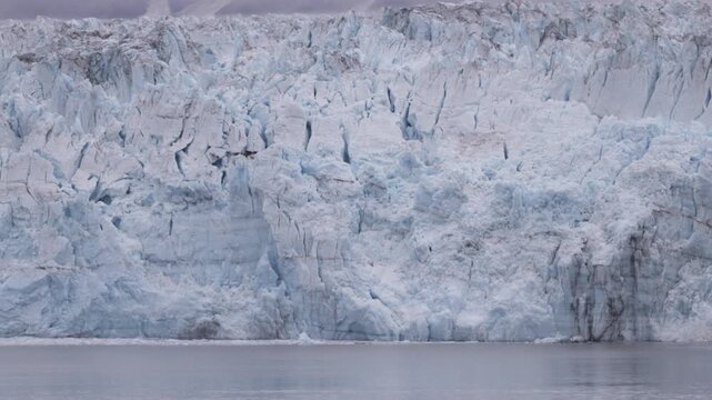 a close tilt up clip of the terminus face of hubbard glacier in alaska of the usa