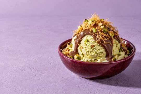 pistachio ice cream with chocolate and crispy pastry topping