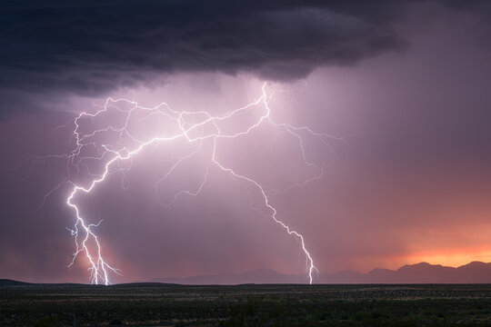 Sunset lightning strike from a storm in New Mexico