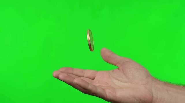 Hand flipping and catching blank gold coin on green screen background