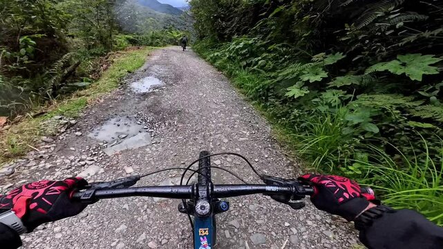 First-person POV of mountain biking down the gravel North Yungas Road in Bolivia