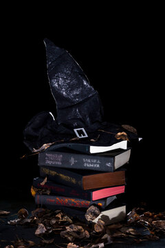 black witch hat on a stack of books