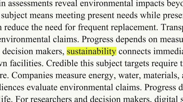 Sustainability comes into focus on a yellow rectangle while black serif paragraphs change around it, with text about energy, water and materials on a white background.
