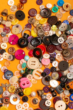 A box with multicolored buttons on a colored background.