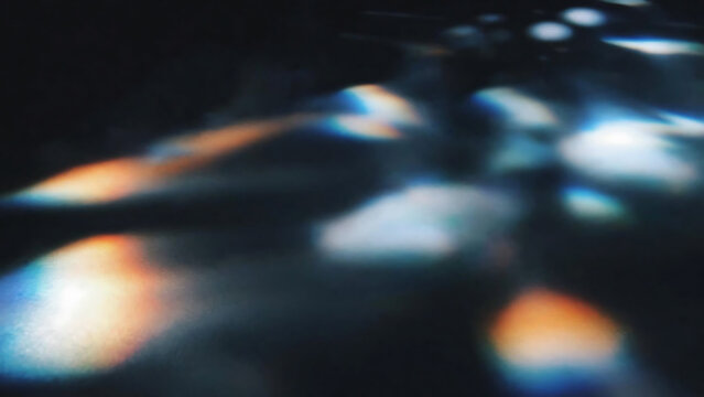 Abstract close-up of colorful glowing shapes on dark background illustration
