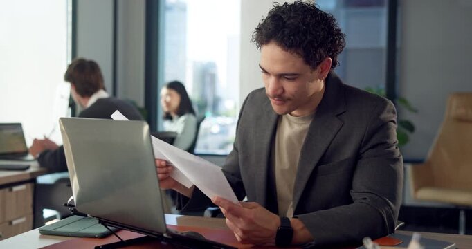 Businessman, reading and documents in office with laptop, planning and admin for virtual assistant. Coworking, administrator and person in agency with computer, review paperwork and schedule for job.
