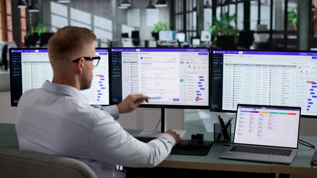 Recruiter Reviews Candidate Resumes On Laptop