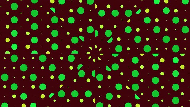 Abstract green and yellow polka dot kaleidoscope pattern rotating on dark background