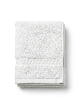 Stacked white terry cloth towel with textured weave and hemmed edges