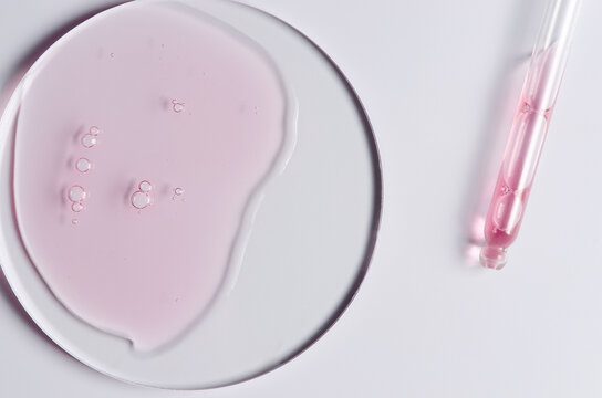 Pink cosmetic product for skin care. A serum or body gel or a moisturizer.