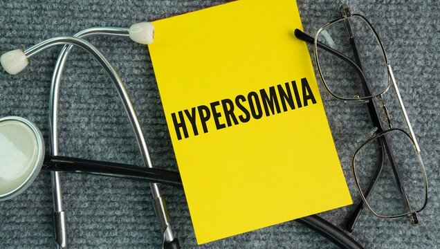 Stethoscope and paper with the word Hypersomnia is a sleep disorder marked by excessive daytime sleepiness EDS or prolonged nighttime sleep that persists for at least 3 months, even after getting a fu