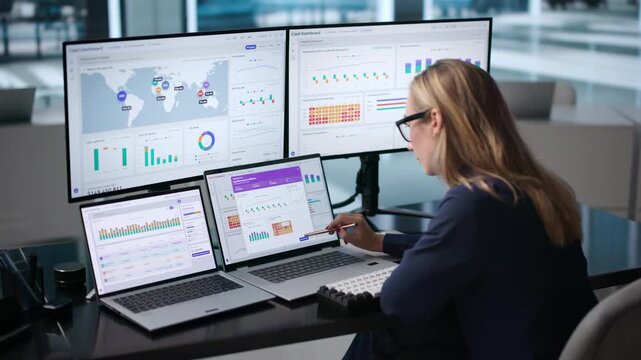 Corporate Treasurer Monitors Real-time Cash Flow On Laptop