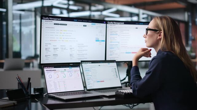 Quality Manager Reviewing Compliance Reports On Laptop