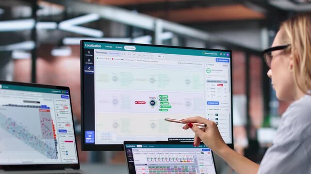 Project Manager Reviews Multilingual Content On Laptop