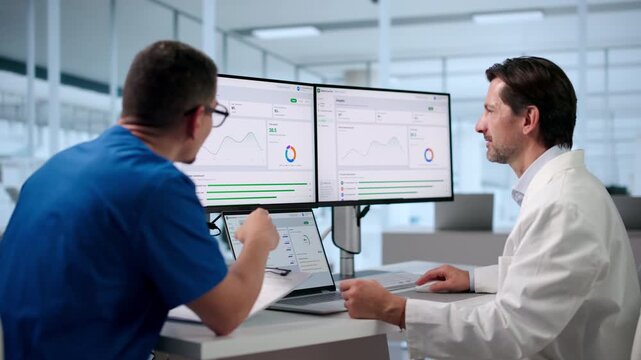 Physicians Review AI-powered Clinical Notes Together Using Laptop