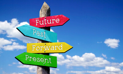 Future, past, forward, present - wooden signpost with four arrows, sky with clouds © PX Media