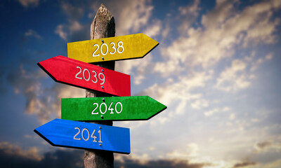 2038, 2039, 2040, 2041 - wooden signpost with four arrows, sunset sky © PX Media
