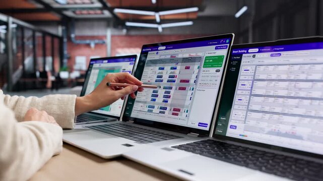 Facility Manager Reviews Building Automation System Dashboard