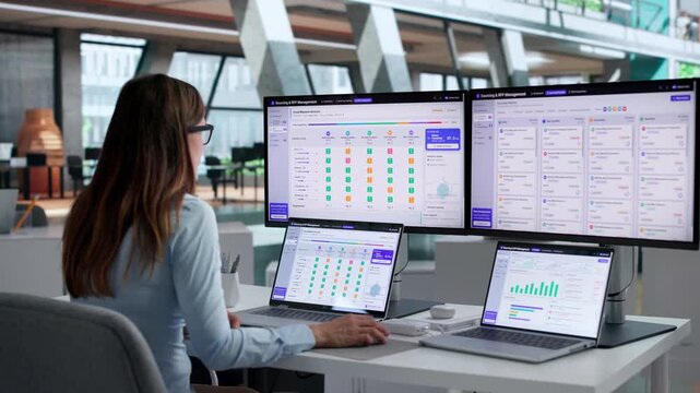 Procurement Manager Using Laptop To Compare Vendor Proposals