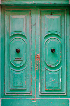 Old Weathered Green Wooden Double Door with Ornate Panels