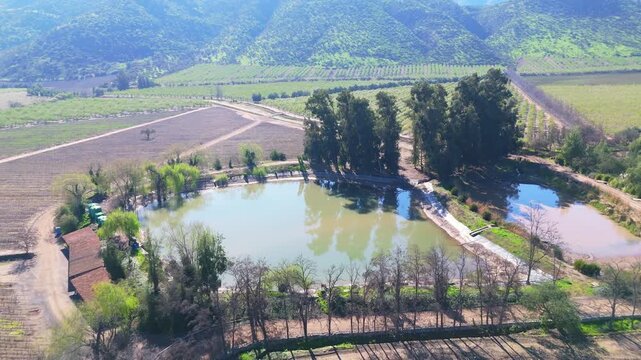 Top view of two water tanks for irrigating trees and fertile soil in the commune of Huelqu&eacute;n, Metropolitan Region, Chile.