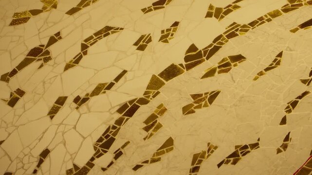 Ornamental mosaic tiles create a warm geometric pattern inside a church