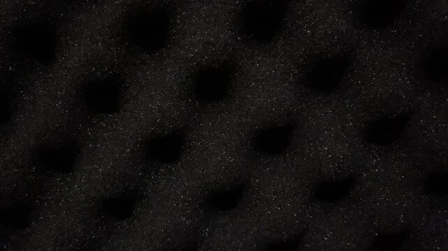 Piled black expanded polystyrene EPS pellets for industrial manufacturing