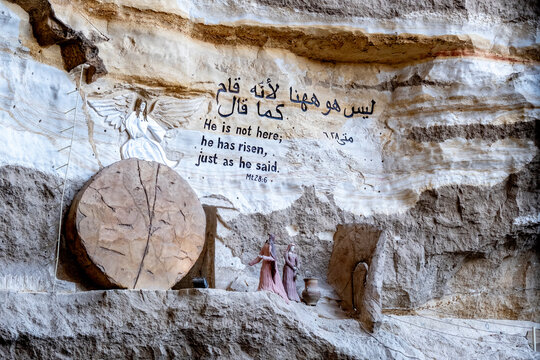 Moqattam neighborhood in Cairo, Egypt. Saint Simon Coptic Monastery. A scene carved into the rock depicts the Resurrection of Christ with the rolled-away stone.