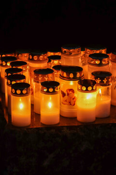 All Saints' Day candles burn at the memorial site in the cemetery as the November evening grows dark. A Finnish way of remembering the departed in the churchyard.