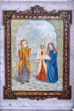 Yonne, Burgundy, France. A framed painted panel in the Church of Saint John the Baptist in Joigny depicting the Presentation of Jesus in the Temple before Simeon.