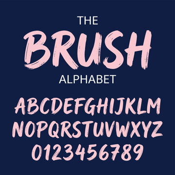 Pink brush script alphabet letters and numbers on dark background