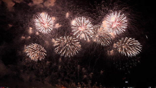 Amazing real beautiful colorful fireworks background on celebration night event for happy new year party, independence day, festivals, Abstract Multi color golden firework in the night sky