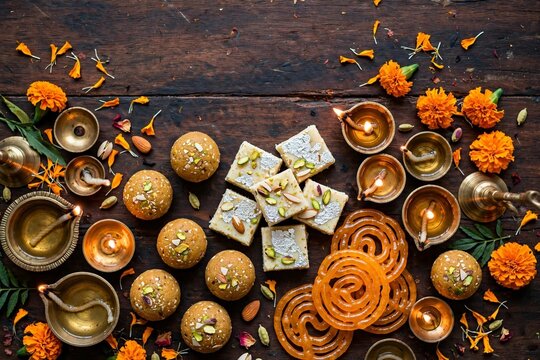 Diwali sweets laddu barfi jalebi with diya top view
