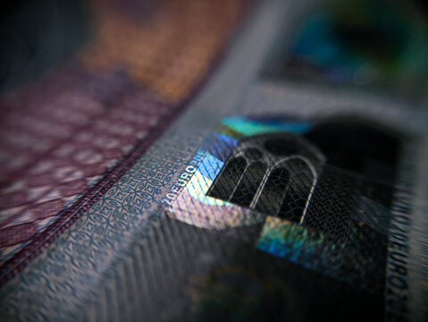 Macro Extreme Close Up of Holographic Foil Strip and Architectural Details on Euro Banknote