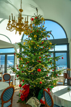 Large decorated Christmas tree in elegant lakeside restaurant