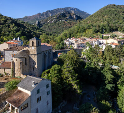 Village of Lapradelle with the Cathare castle of Puilaurens on a hiltop in the backgournd, in Aude, France