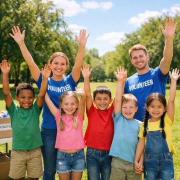 volunteers and kids waving in a park