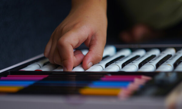 Close-up of a little girl hand choosing a marker pen