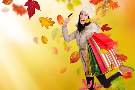 Happy Woman Carrying Shopping Bags and Credit Card During Autumn Shopping