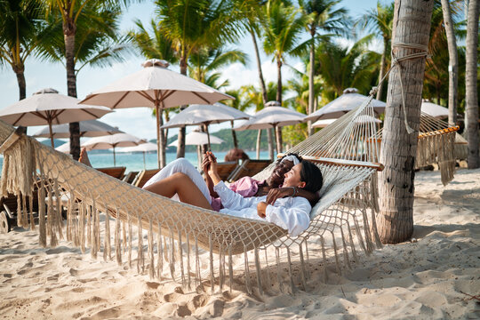 Happy interracial couple embracing and sharing a romantic moment during a tropical island getaway