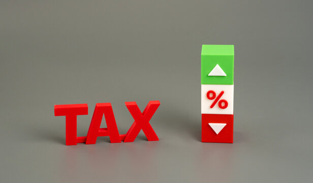 Blocks with the word Tax and up and down arrows. rising and falling tax rates, fiscal policy, financial changes, government taxation, economic trends, business planning, and revenue management.