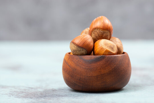 Hazelnuts in a wooden bowl, healthy nuts food, nutrition, ingredients for baking, protein and antioxidants