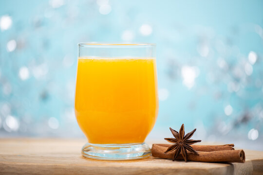 Orange juice punch, hot winter drink with fresh fruit, cinnamon and star anise spice, christmas season, citrus bererage, healthy breakfast